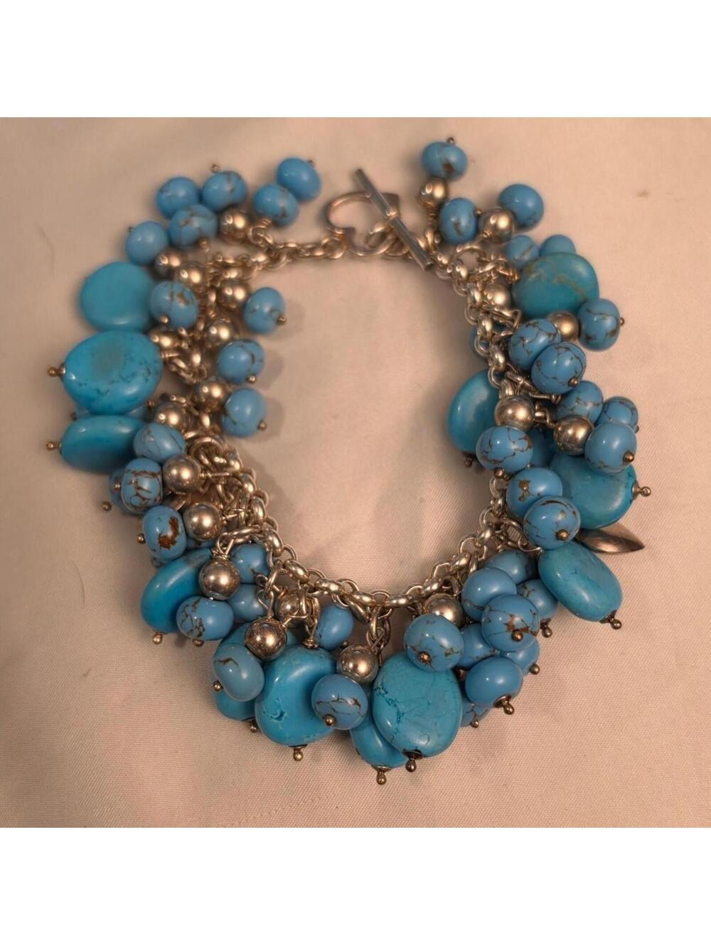 925 bracelet with Blue stones and 925 Italy Heart charms. sz7. 75.29gs